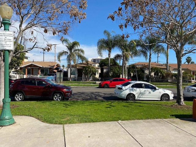 view of parking with a residential view