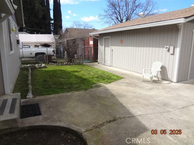 view of yard with a patio area and fence