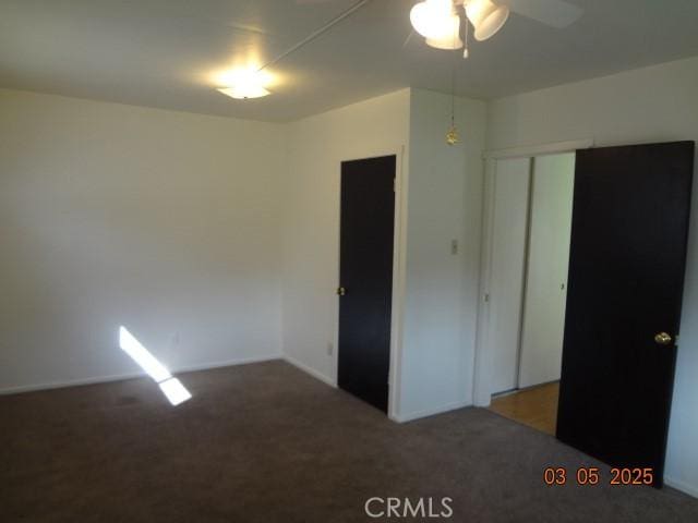 unfurnished bedroom with a closet and carpet flooring