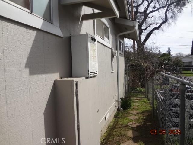 view of home's exterior featuring fence