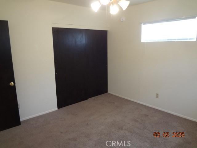 unfurnished bedroom with carpet