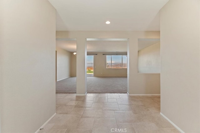 unfurnished room featuring baseboards and recessed lighting