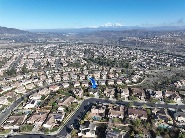 birds eye view of property with a mountain view and a residential view