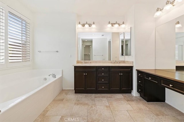 bathroom with a bath, tile patterned flooring, double vanity, and a sink