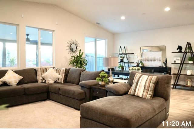 living room featuring recessed lighting, visible vents, vaulted ceiling, and wood finished floors