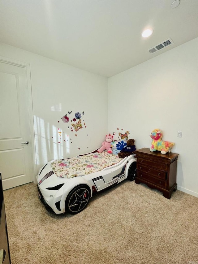 carpeted bedroom with visible vents