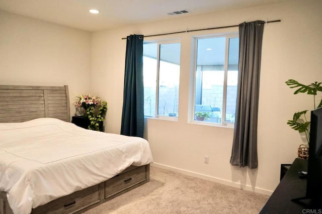 bedroom with carpet floors, recessed lighting, visible vents, and baseboards