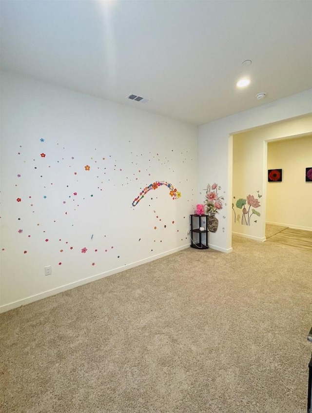 game room with light carpet, visible vents, and baseboards