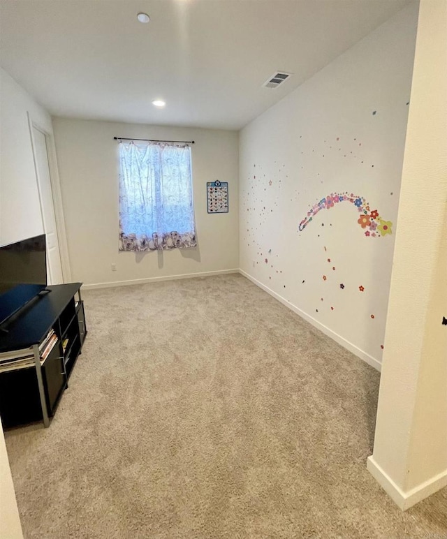 interior space featuring carpet, visible vents, and baseboards