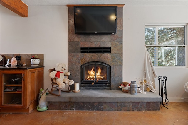 interior details with a tile fireplace