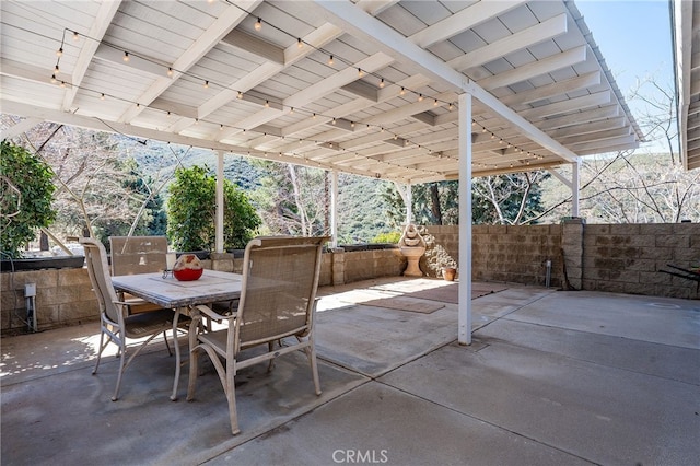 view of patio / terrace featuring outdoor dining area and fence