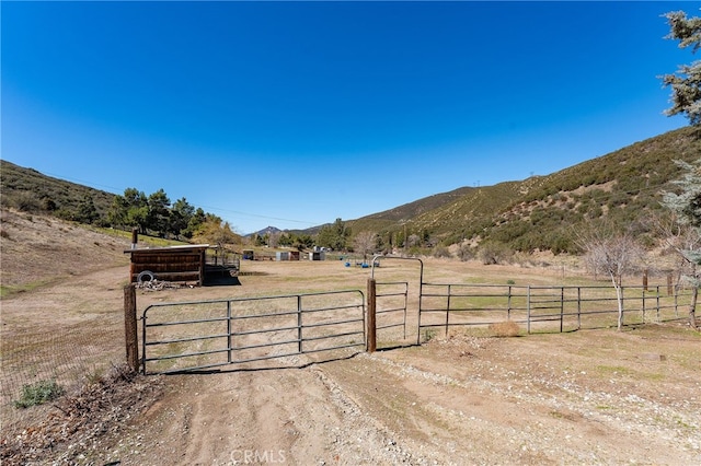 exterior space with a rural view and a mountain view