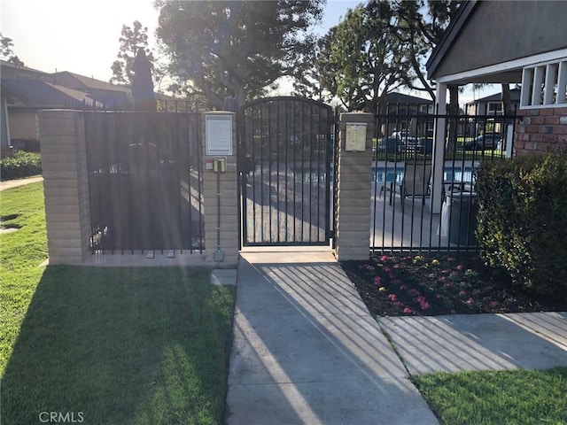 view of gate with fence