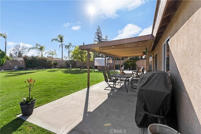 view of patio / terrace with area for grilling and a fenced backyard