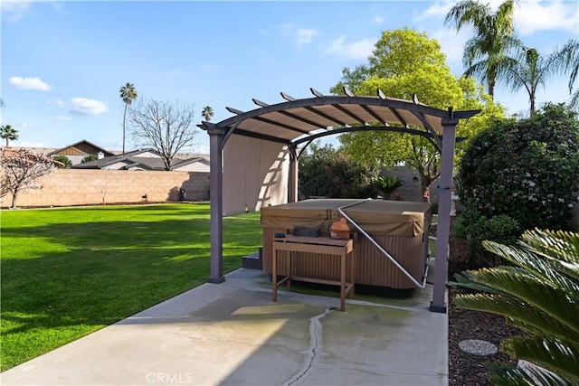 exterior space with a pergola, fence, and a hot tub