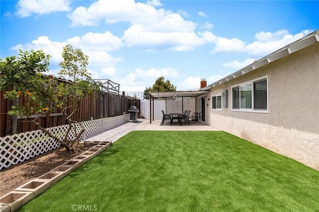 view of yard with a patio area and a fenced backyard