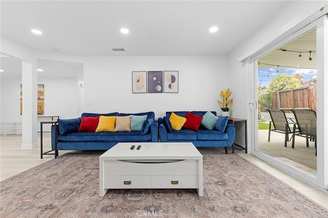 living room with recessed lighting and visible vents