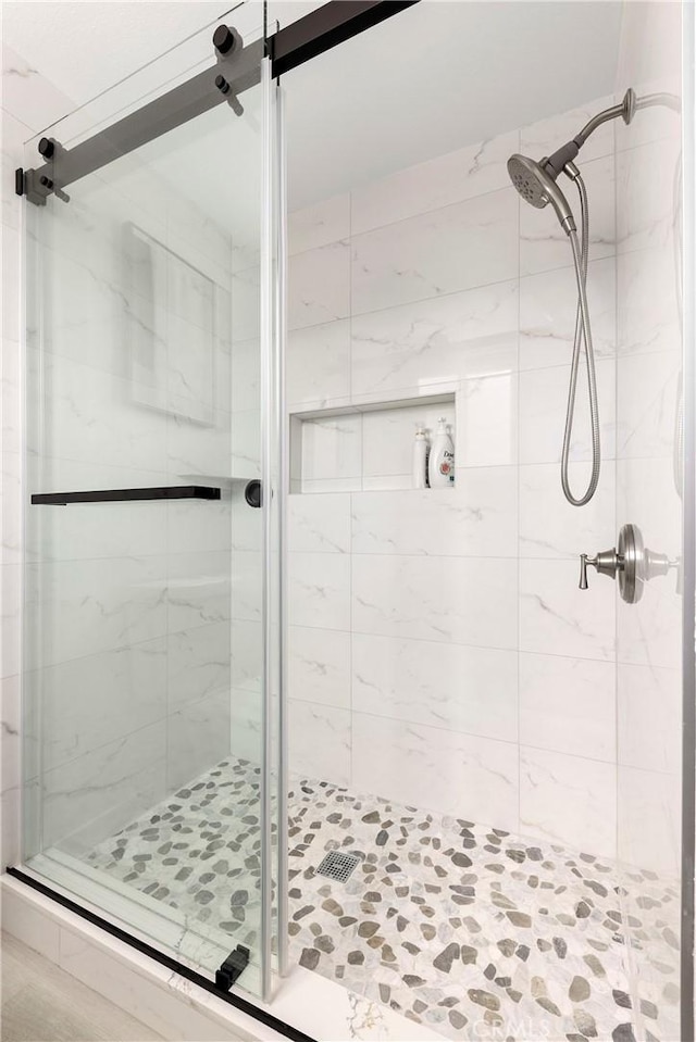 full bathroom featuring a shower stall