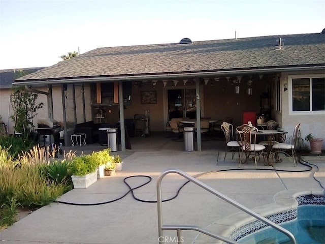 19010 Waseca Rd, Apple Valley, CA 92307 - rear view of house with a patio area, roof with shingles, and stucco siding