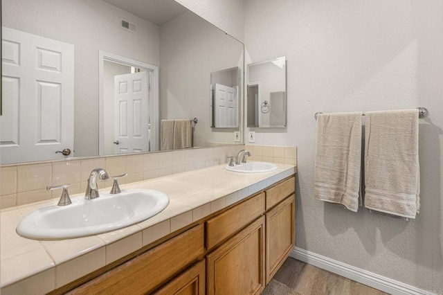 14797 Wild Colt Pl, Jamul, CA 91935 - bathroom with double vanity, wood finished floors, and baseboards