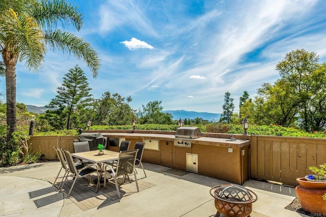 14797 Wild Colt Pl, Jamul, CA 91935 - view of patio / terrace featuring a mountain view and outdoor dining space