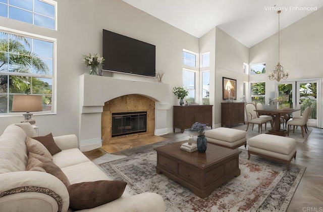 14797 Wild Colt Pl, Jamul, CA 91935 - living area with a towering ceiling, healthy amount of natural light, a chandelier, a high end fireplace, and baseboards