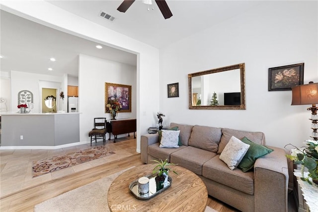 living area featuring recessed lighting, visible vents, ceiling fan, and light wood-style floors