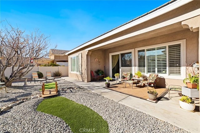 view of patio featuring fence