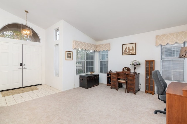 office space featuring vaulted ceiling, tile patterned floors, carpet floors, and a chandelier