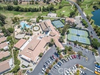 aerial view featuring golf course view and a water view