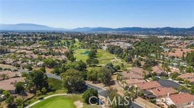 birds eye view of property featuring golf course view and a mountain view