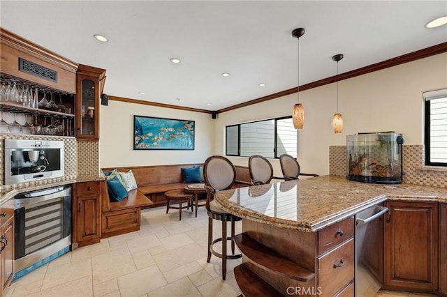 kitchen featuring wine cooler, hanging light fixtures, a peninsula, and open shelves