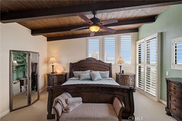 carpeted bedroom featuring beamed ceiling, wood ceiling, and baseboards