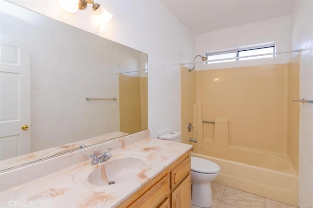 bathroom featuring toilet, tile patterned floors, vanity, and shower / washtub combination