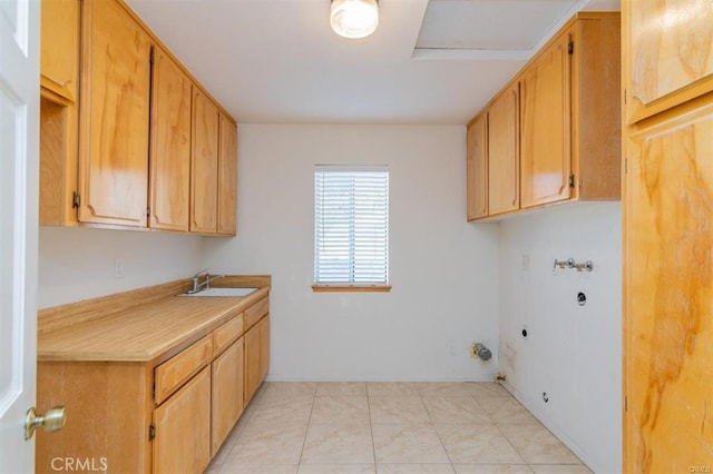 laundry room featuring light tile patterned floors, hookup for an electric dryer, cabinet space, a sink, and washer hookup