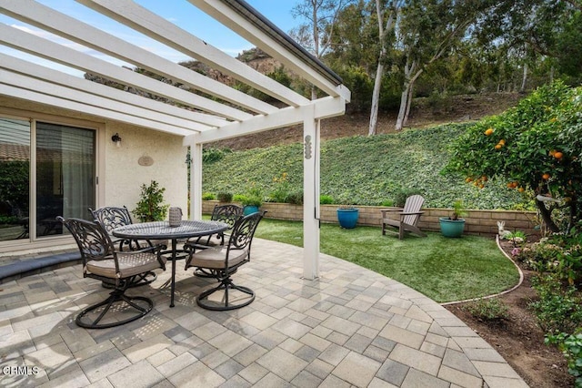 view of patio / terrace featuring a pergola and outdoor dining space
