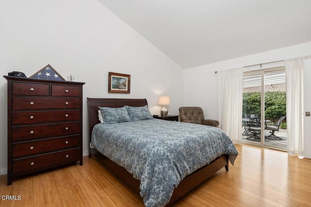 bedroom with access to exterior, light wood-style floors, lofted ceiling, and baseboards