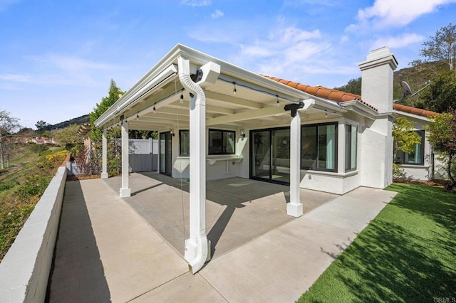 view of patio / terrace featuring fence