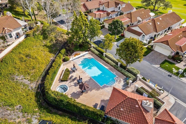 birds eye view of property with a residential view