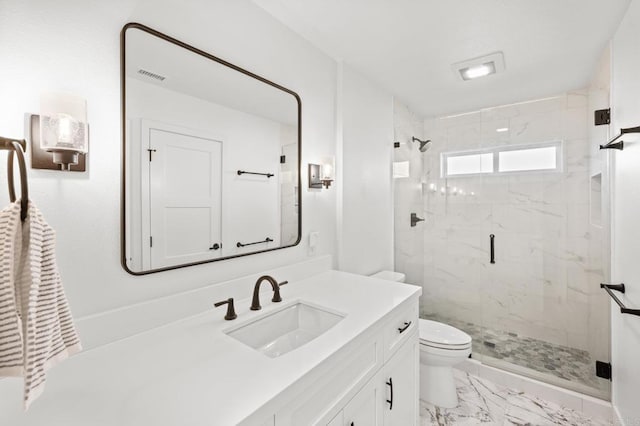 full bath with toilet, marble finish floor, a marble finish shower, and vanity