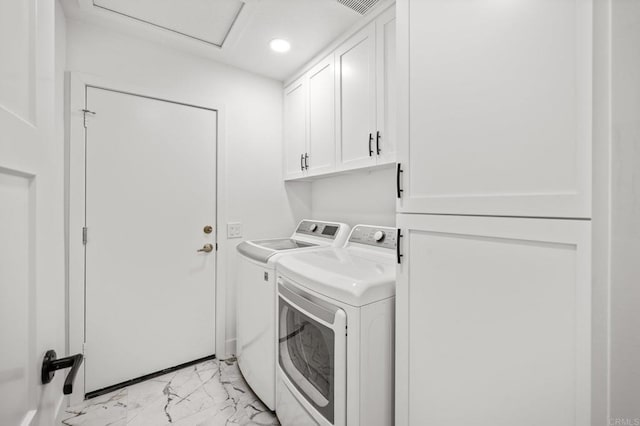 clothes washing area with cabinet space, attic access, marble finish floor, washing machine and dryer, and recessed lighting