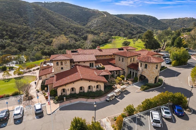 birds eye view of property with a mountain view