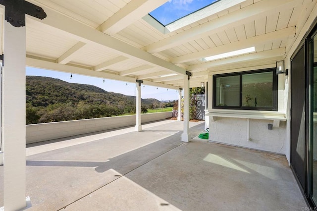 view of patio / terrace with a mountain view