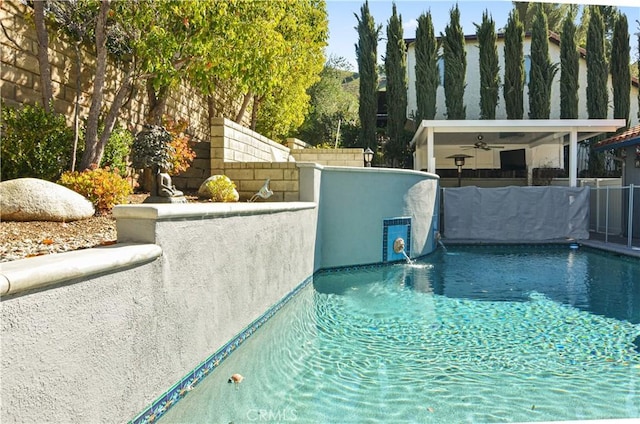 view of pool with a fenced in pool and fence