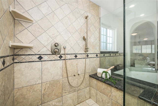 bathroom with tiled shower