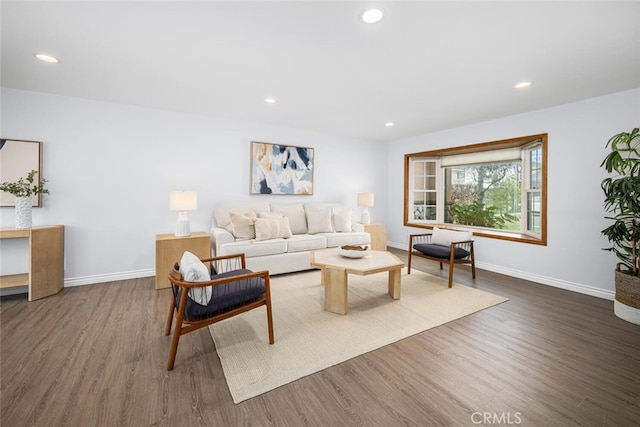 living room featuring recessed lighting, baseboards, and wood finished floors