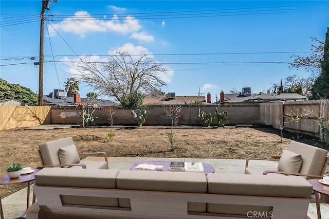 view of yard with a patio, outdoor lounge area, and a fenced backyard