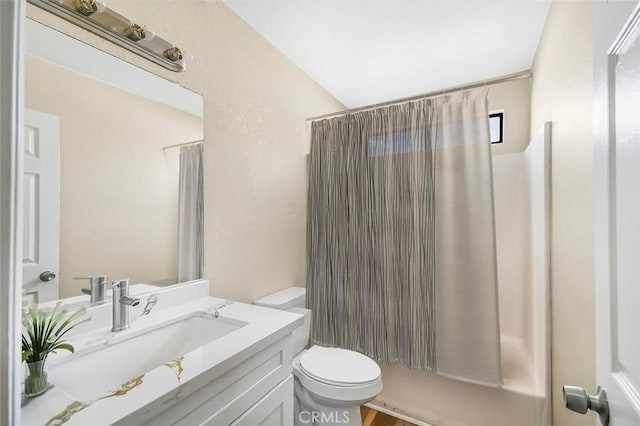 bathroom featuring a shower with shower curtain, vanity, and toilet