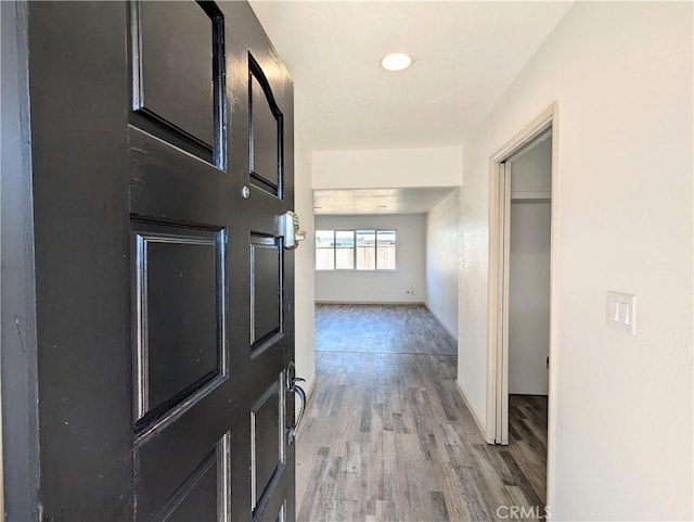 corridor featuring light wood-style flooring