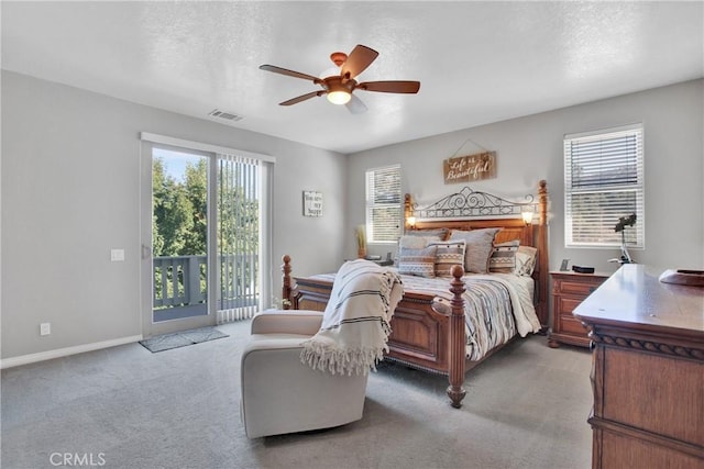 bedroom with access to exterior, visible vents, multiple windows, and light carpet